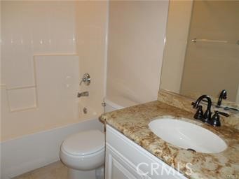 44 Duet Irvine, CA 92603 - Photo 13 of 18 a bathroom with a granite countertop sink a toilet and a mirror