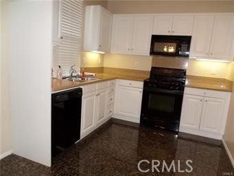 44 Duet Irvine, CA 92603 - Photo 3 of 18 a kitchen with a sink a stove and cabinets