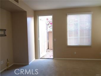 44 Duet Irvine, CA 92603 - Photo 8 of 18 a view of an empty room with a window