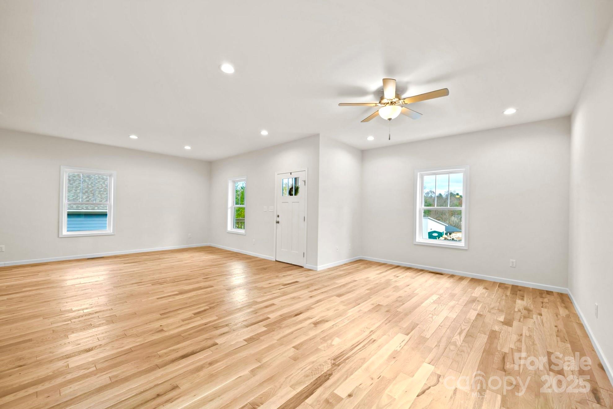 7 Berry Crest Lane Arden, NC 28704 - Photo 13 of 41 an empty room with window and a ceiling fan