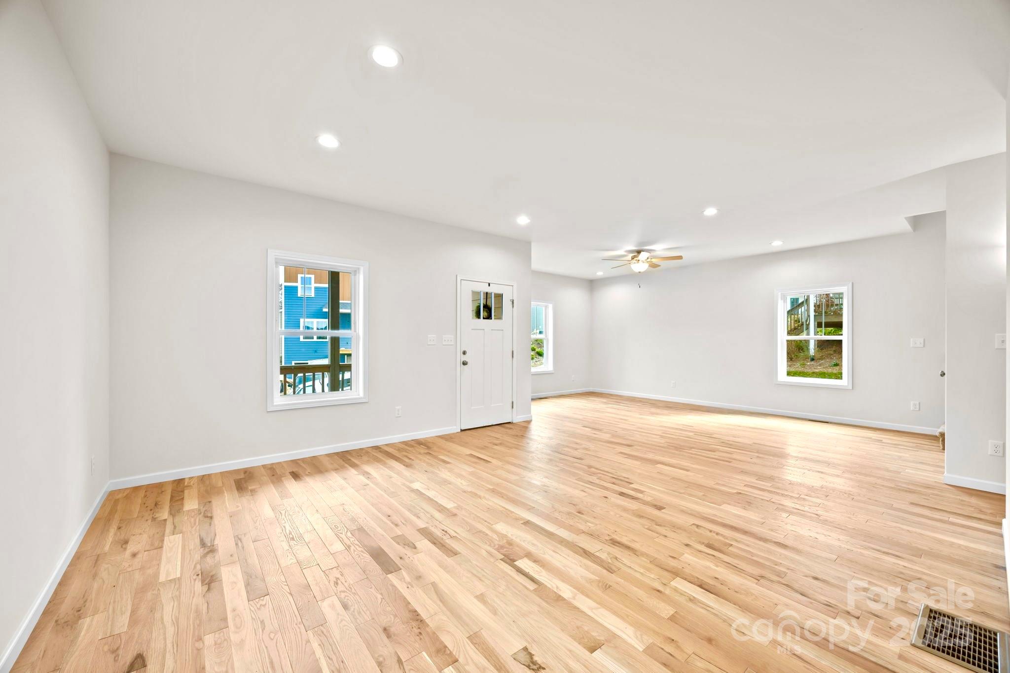 7 Berry Crest Lane Arden, NC 28704 - Photo 20 of 41 a view of empty room with window and wooden floor