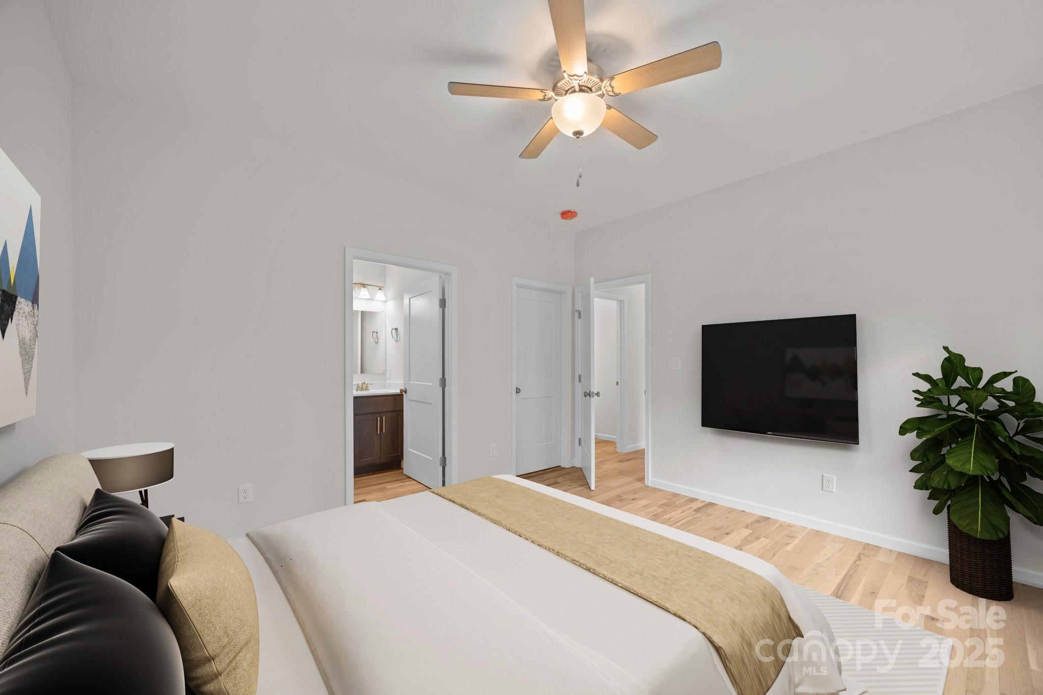 7 Berry Crest Lane Arden, NC 28704 - Photo 29 of 41 a bedroom with a bed and a flat screen tv