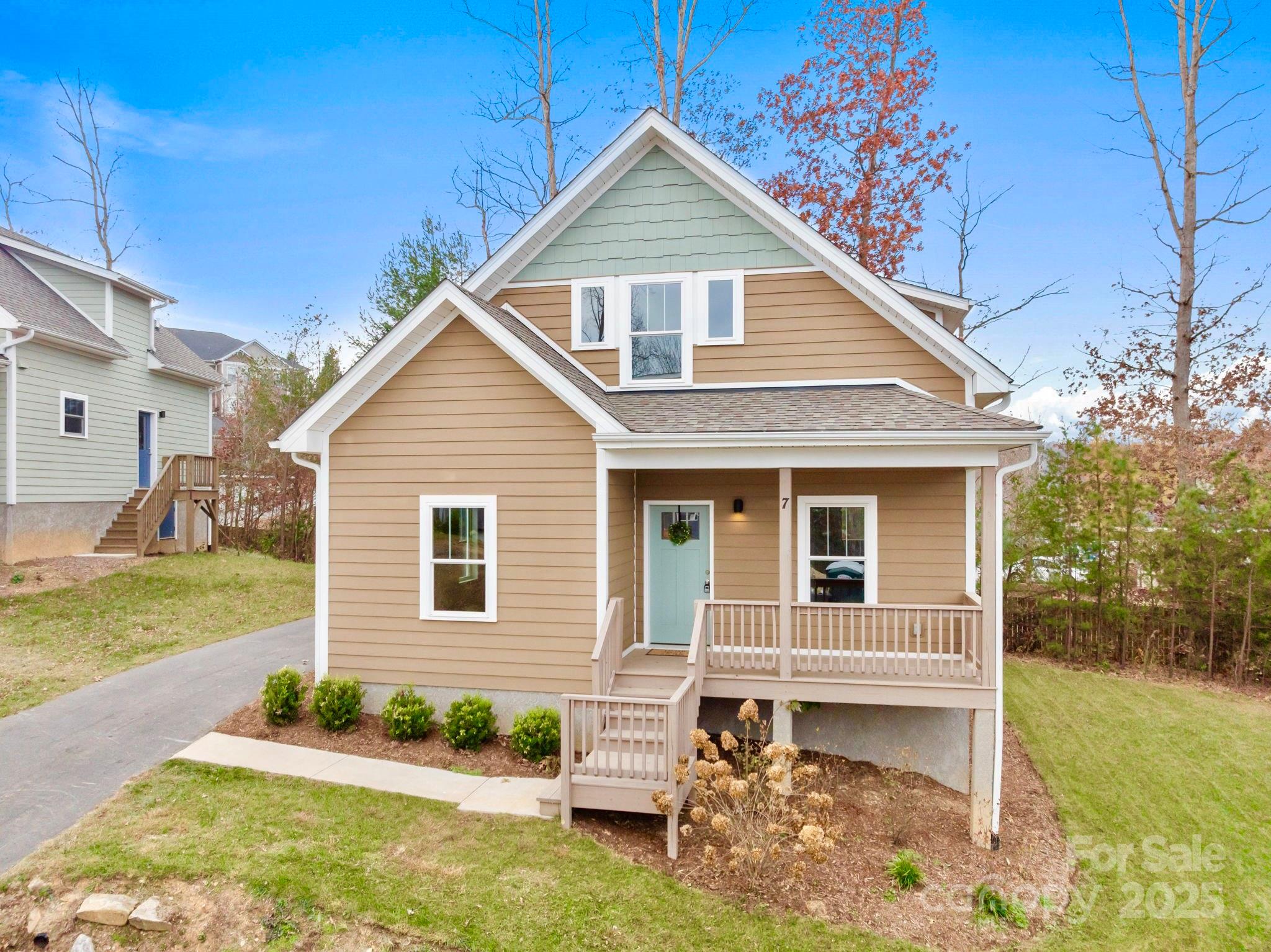 7 Berry Crest Lane Arden, NC 28704 - Photo 3 of 41 a front view of a house with garden