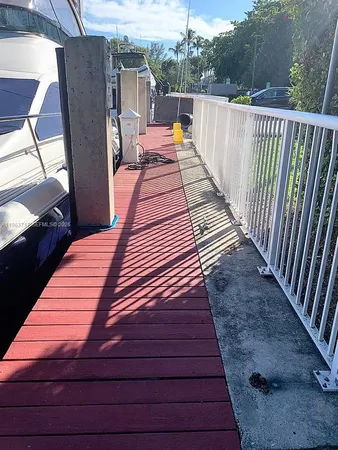 a balcony view with a seating space