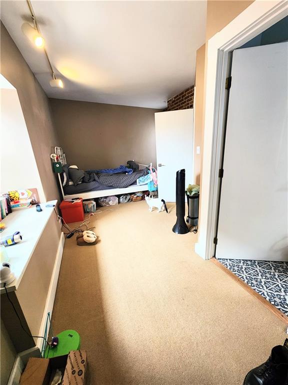 196 37th Street Pittsburgh, PA 15201 - Photo 2 of 7 a bed room with furniture and a window