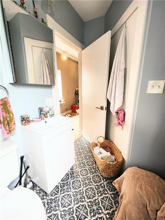 196 37th Street Pittsburgh, PA 15201 - Photo 4 of 7 a bedroom with a bed and a window