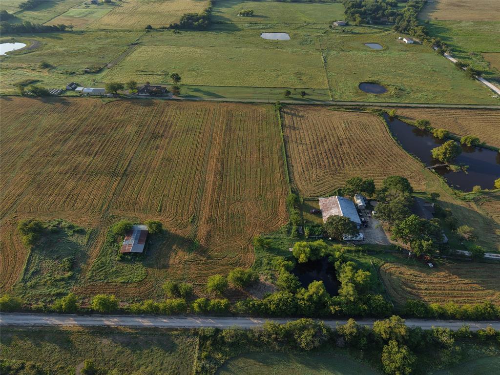 1010 Northeast County Road 1010 Rice, TX 75155 - Photo 1 of 15 an aerial view of a house with a yard