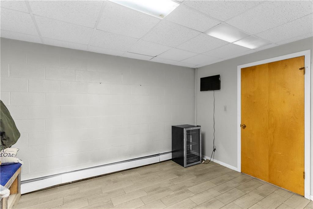 522 Spring Street Jamestown, PA 16134 - Photo 11 of 35 a view of an empty room with wooden floor and a window