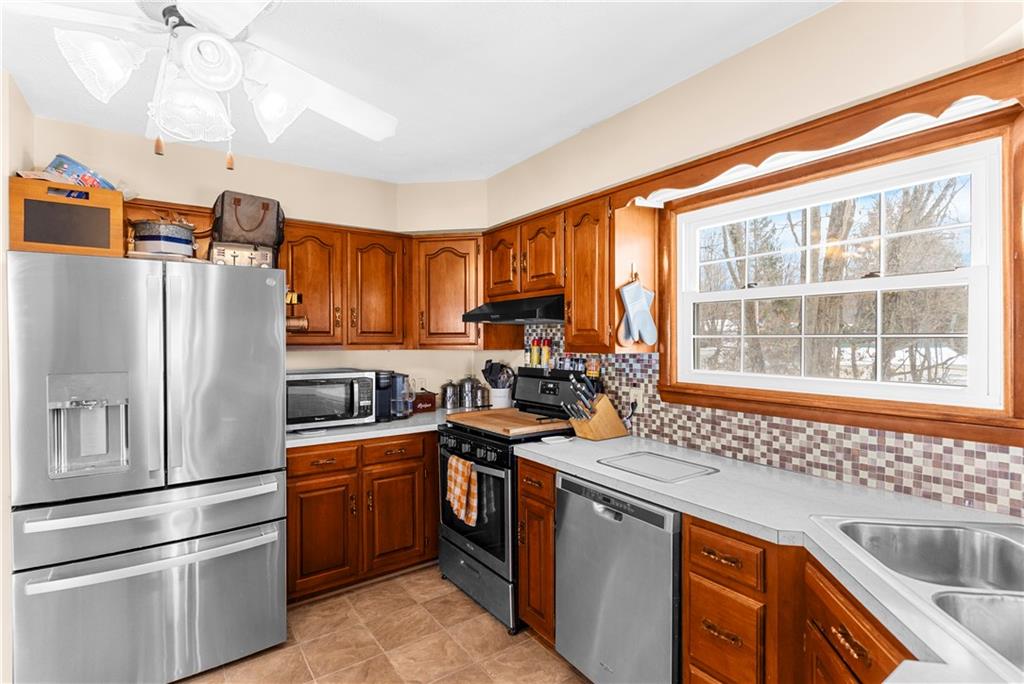 522 Spring Street Jamestown, PA 16134 - Photo 14 of 35 a kitchen with a sink stove and refrigerator
