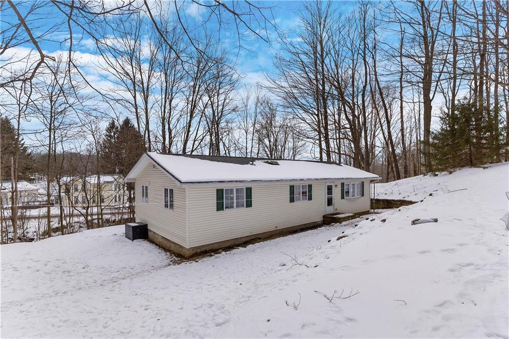 522 Spring Street Jamestown, PA 16134 - Photo 26 of 35 a view of a house with a yard covered in snow