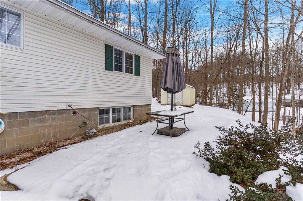 522 Spring Street Jamestown, PA 16134 - Photo 28 of 35 a view of a backyard with chairs and a swing