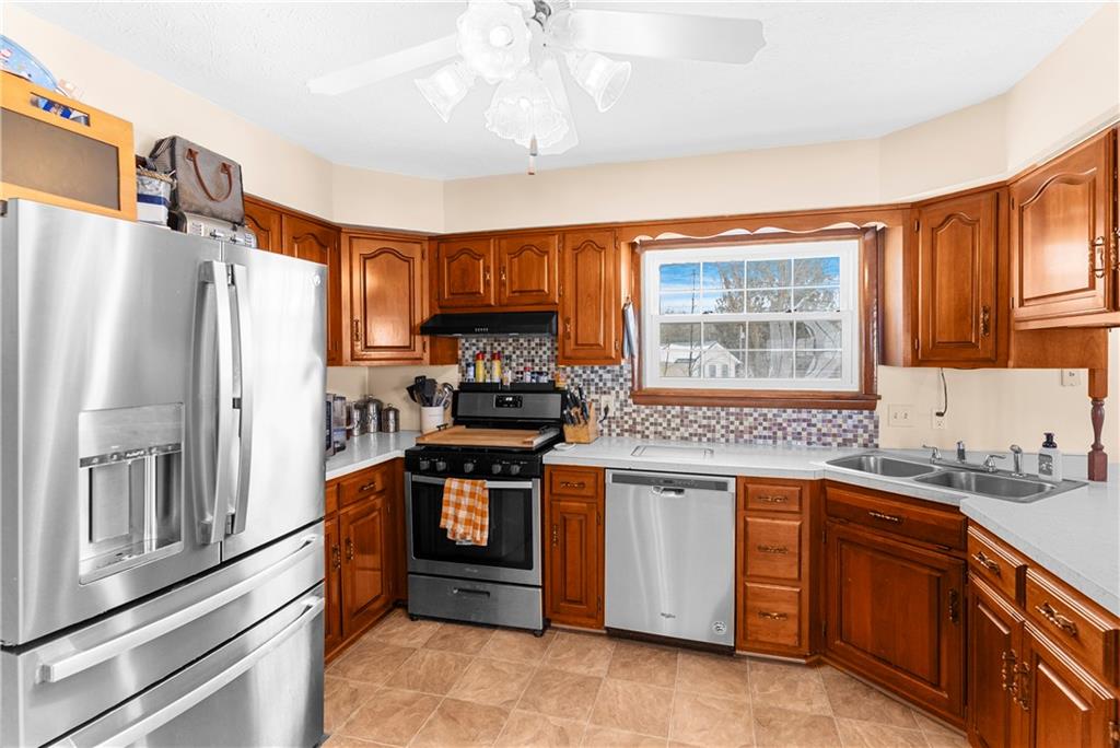 522 Spring Street Jamestown, PA 16134 - Photo 8 of 35 a kitchen with stainless steel appliances granite countertop a stove a sink dishwasher a refrigerator and a microwave