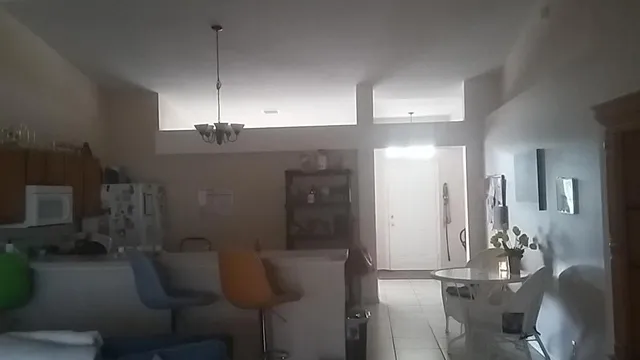 a view of hall way with furniture