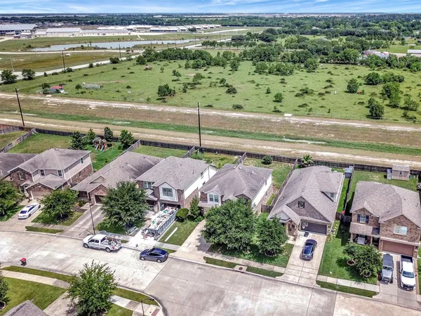 an aerial view of a house with a yard