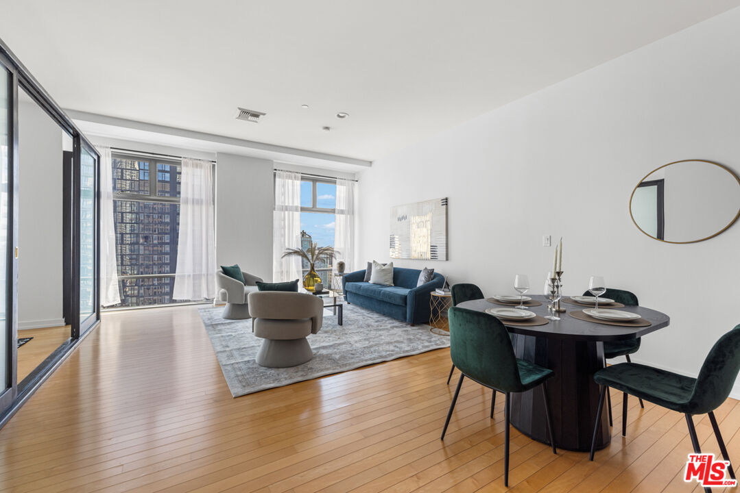 a living room with fireplace furniture and a wooden floor