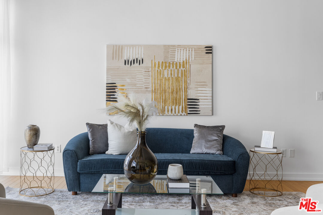 801 South Grand Avenue, Unit 1508 Los Angeles, CA 90017 - Photo 18 of 56 a living room with furniture and a window