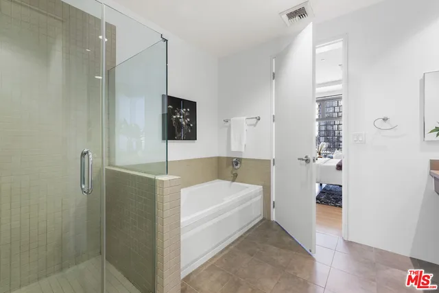 a view of a bathroom from a hallway