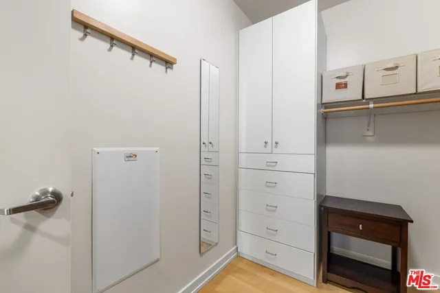 a bedroom with a bed and a table