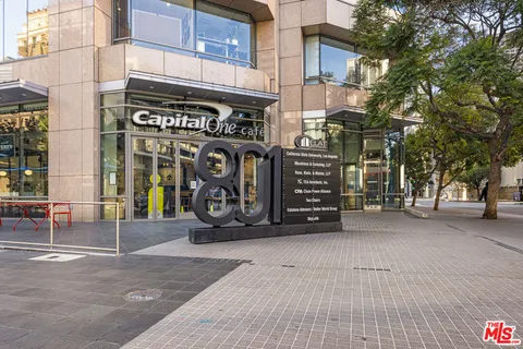a view of a street with a garage