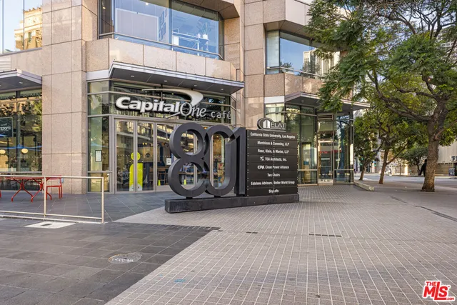 a view of a street with a garage