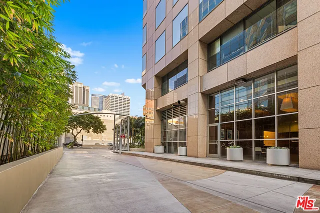 a living room with couches coffee table and a flat screen tv