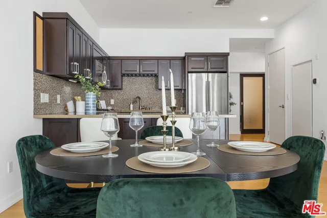 a table with a vase and flowers on it