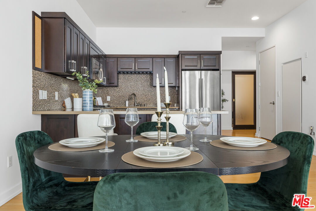 801 South Grand Avenue, Unit 1508 Los Angeles, CA 90017 - Photo 10 of 56 a view of a dining room with furniture