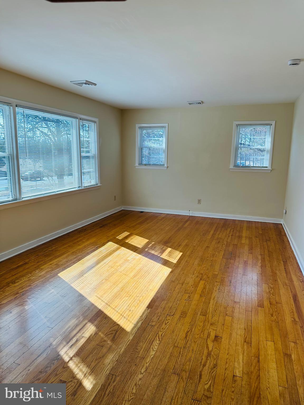 11447 Marsh Road Bealeton, VA 22712 - Photo 2 of 9 a view of a room with wooden floor and windows