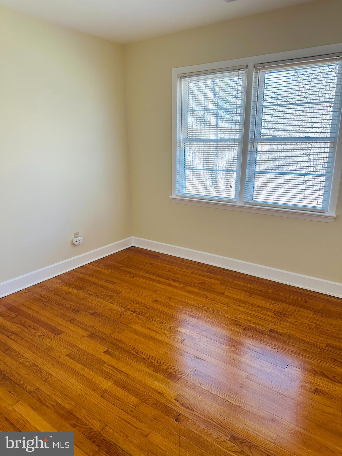11447 Marsh Road Bealeton, VA 22712 - Photo 7 of 9 an empty room with wooden floor and windows
