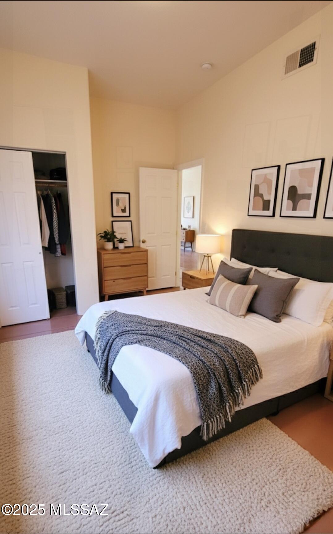 533 West San Xavier Road Tucson, AZ 85713 - Photo 20 of 21 a spacious bedroom with a bed and a couch