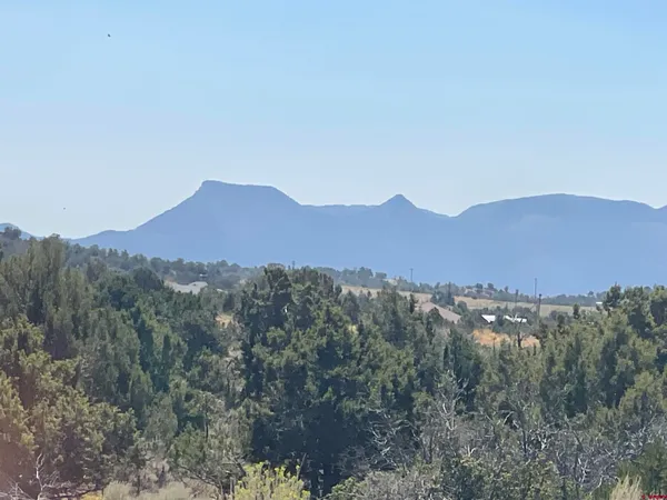 a view of mountains and valleys