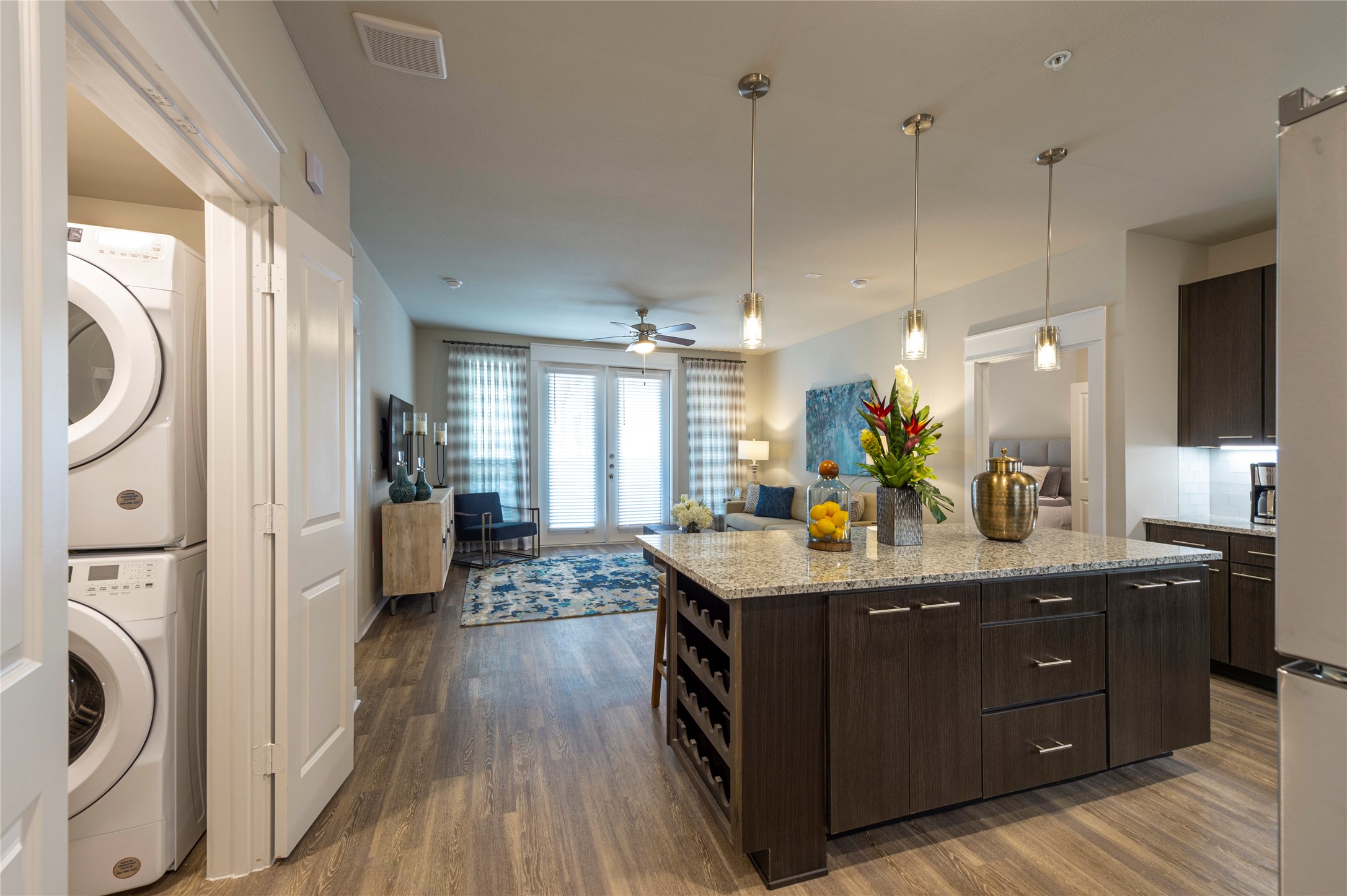 1616 Partnership Way, Unit 2219 Katy, TX 77449 - Photo 12 of 22 a kitchen with sink a refrigerator and wooden floor