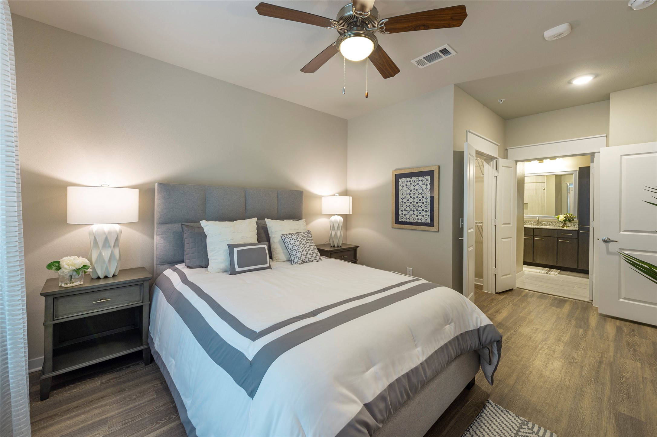 1616 Partnership Way, Unit 2219 Katy, TX 77449 - Photo 14 of 22 a bedroom with a bed and a walk in closet