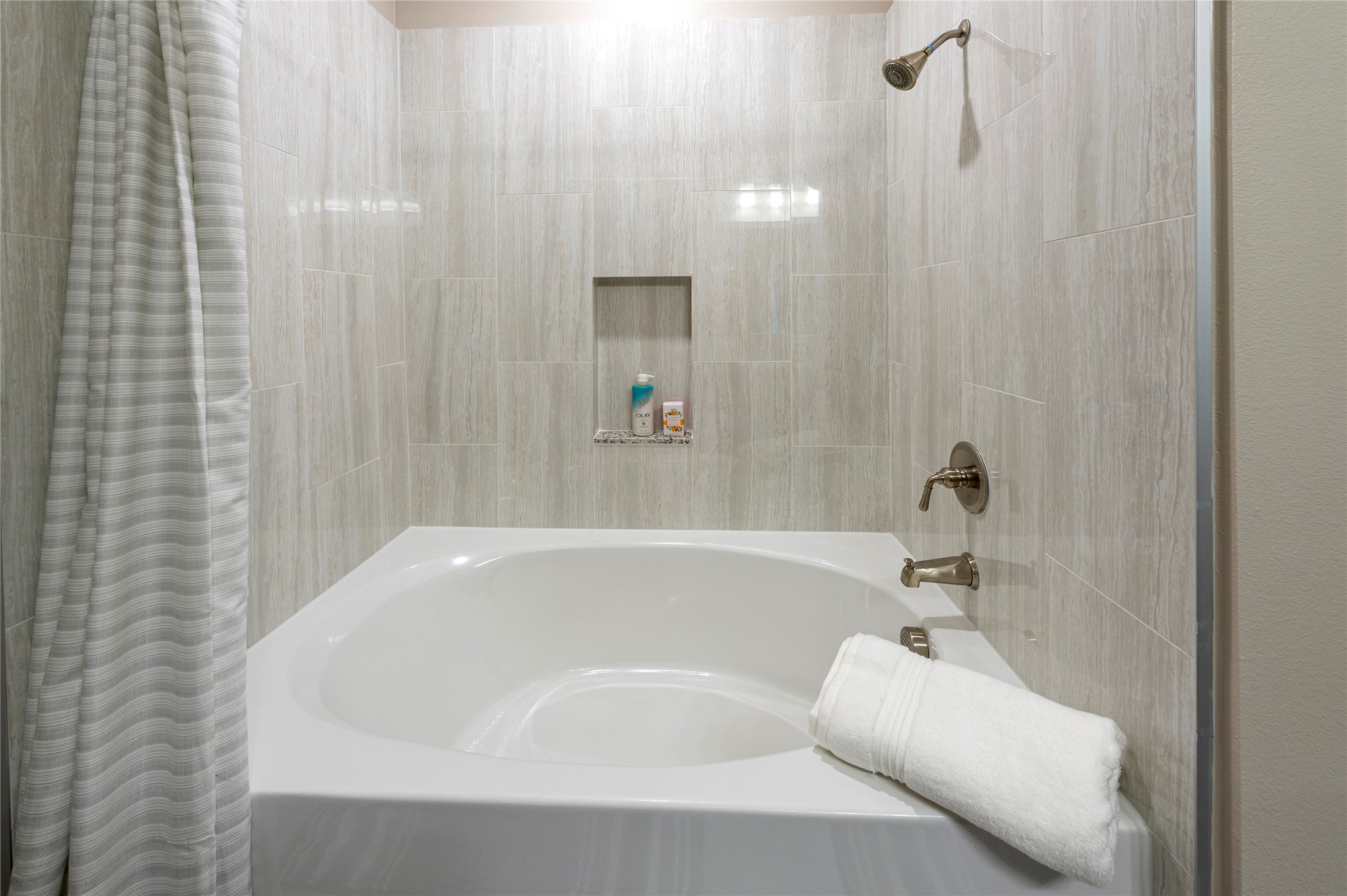1616 Partnership Way, Unit 2219 Katy, TX 77449 - Photo 17 of 22 a bathroom with a white bath tub