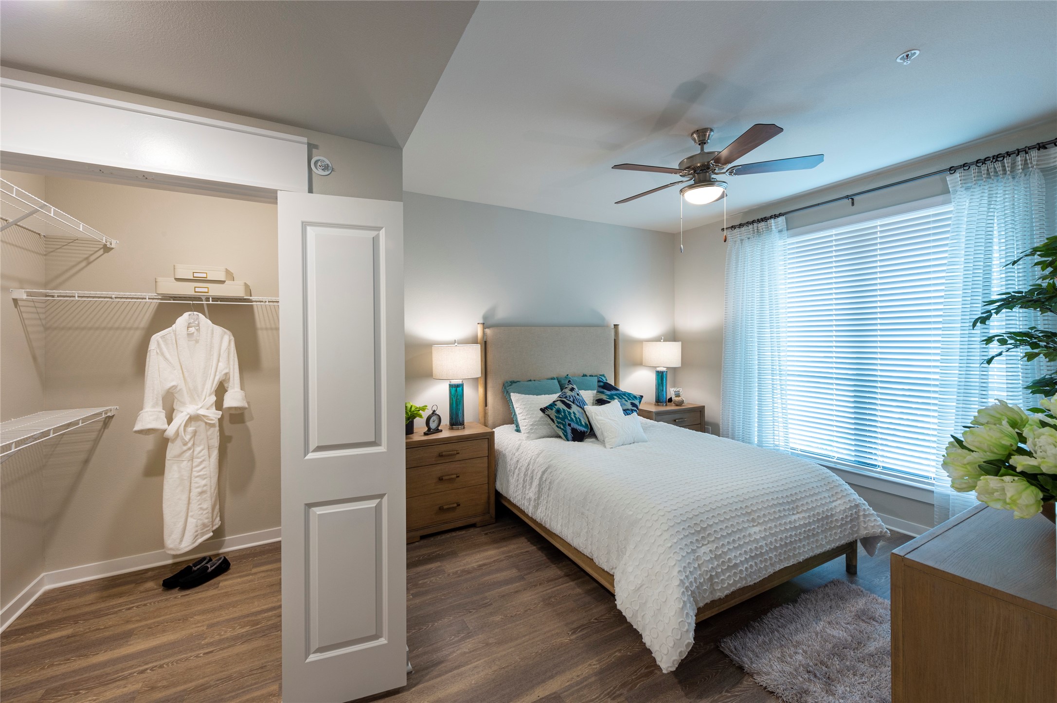 1616 Partnership Way, Unit 2219 Katy, TX 77449 - Photo 21 of 22 a bedroom with a bed and a chandelier