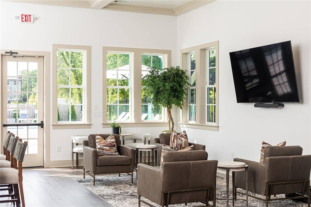 3373 Fence Road Northeast, Unit D4 Dacula, GA 30019 - Photo 13 of 40 a living room with furniture tv and a window