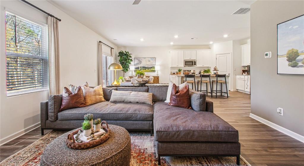 3373 Fence Road Northeast, Unit D4 Dacula, GA 30019 - Photo 22 of 40 a living room with furniture couches and a large window
