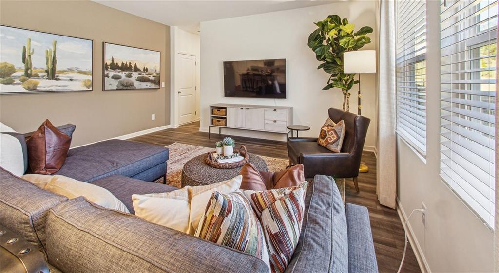 3373 Fence Road Northeast, Unit D4 Dacula, GA 30019 - Photo 23 of 40 a living room with furniture and a flat screen tv