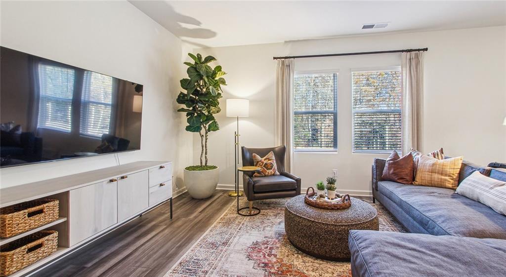 3373 Fence Road Northeast, Unit D4 Dacula, GA 30019 - Photo 24 of 40 a living room with furniture and a large window