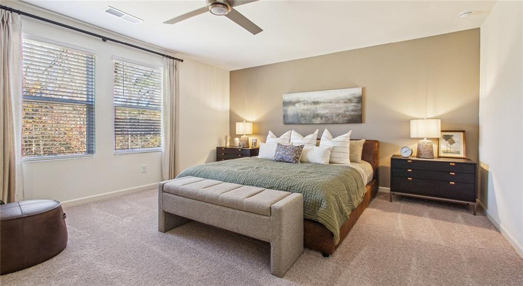 3373 Fence Road Northeast, Unit D4 Dacula, GA 30019 - Photo 27 of 40 a bedroom with a bed and wooden floor