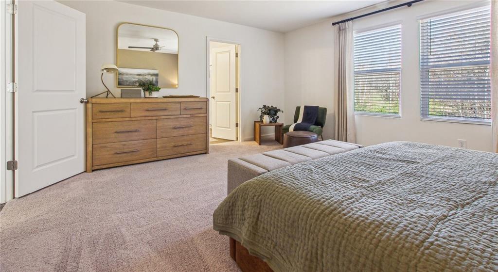 3373 Fence Road Northeast, Unit D4 Dacula, GA 30019 - Photo 28 of 40 a bedroom with a bed and a dresser