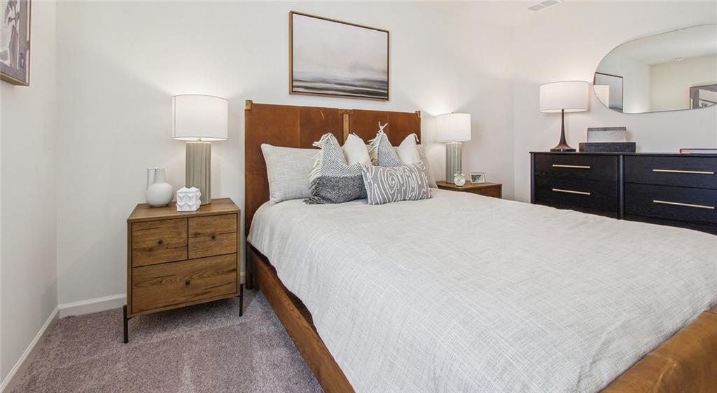 3373 Fence Road Northeast, Unit D4 Dacula, GA 30019 - Photo 32 of 40 a bed room with a bed and a lamp