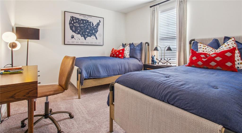 3373 Fence Road Northeast, Unit D4 Dacula, GA 30019 - Photo 37 of 40 a bedroom with two beds and a window