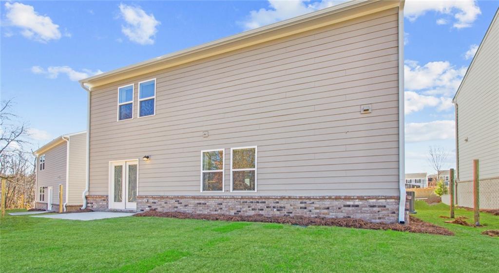 3373 Fence Road Northeast, Unit D4 Dacula, GA 30019 - Photo 40 of 40 a view of a house with a backyard