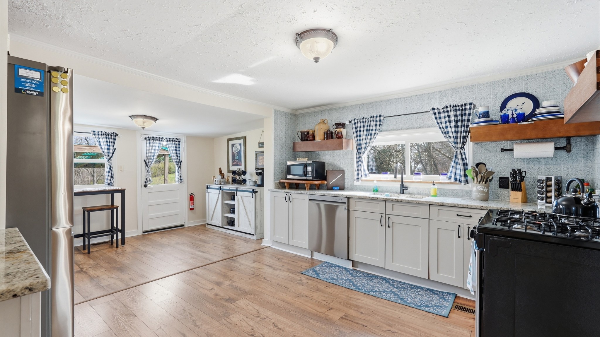 2830 Lockertsville Road Ashland City, TN 37015 - Photo 78 of 100 a kitchen with stainless steel appliances granite countertop a refrigerator and a sink