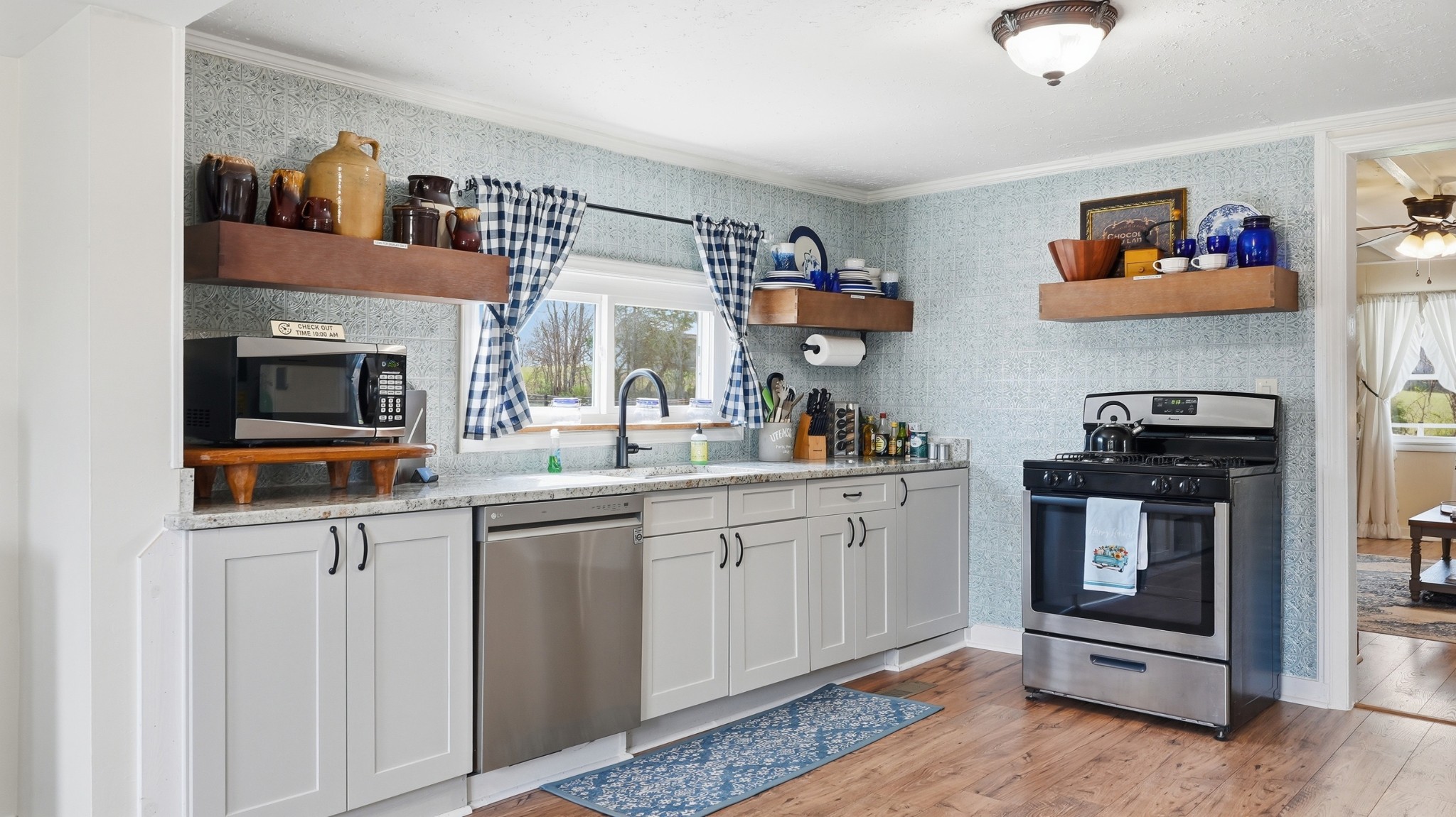 2830 Lockertsville Road Ashland City, TN 37015 - Photo 79 of 100 a kitchen with stainless steel appliances granite countertop a stove and a sink