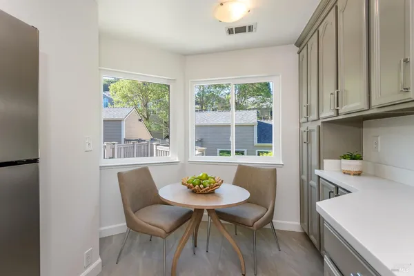 a view of a dining room with furniture window and outside view