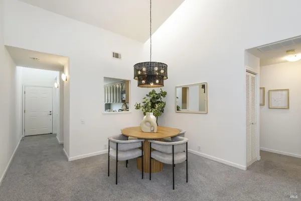 a dining room with a table and chairs