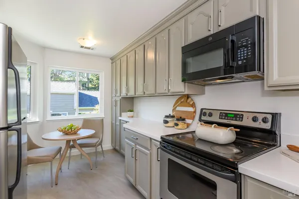 a kitchen with a stove and a microwave
