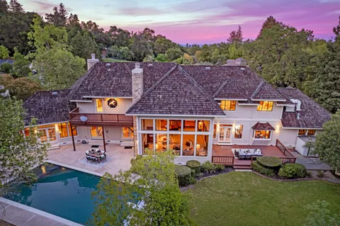 an aerial view of a house with a garden
